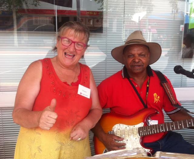 Volunteer evangelist Dawn with a guitar player