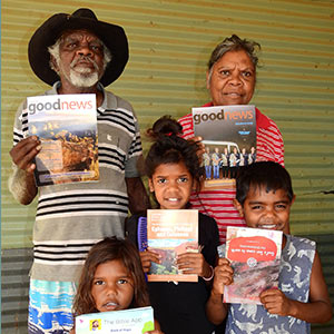 family in the outback holding bibles